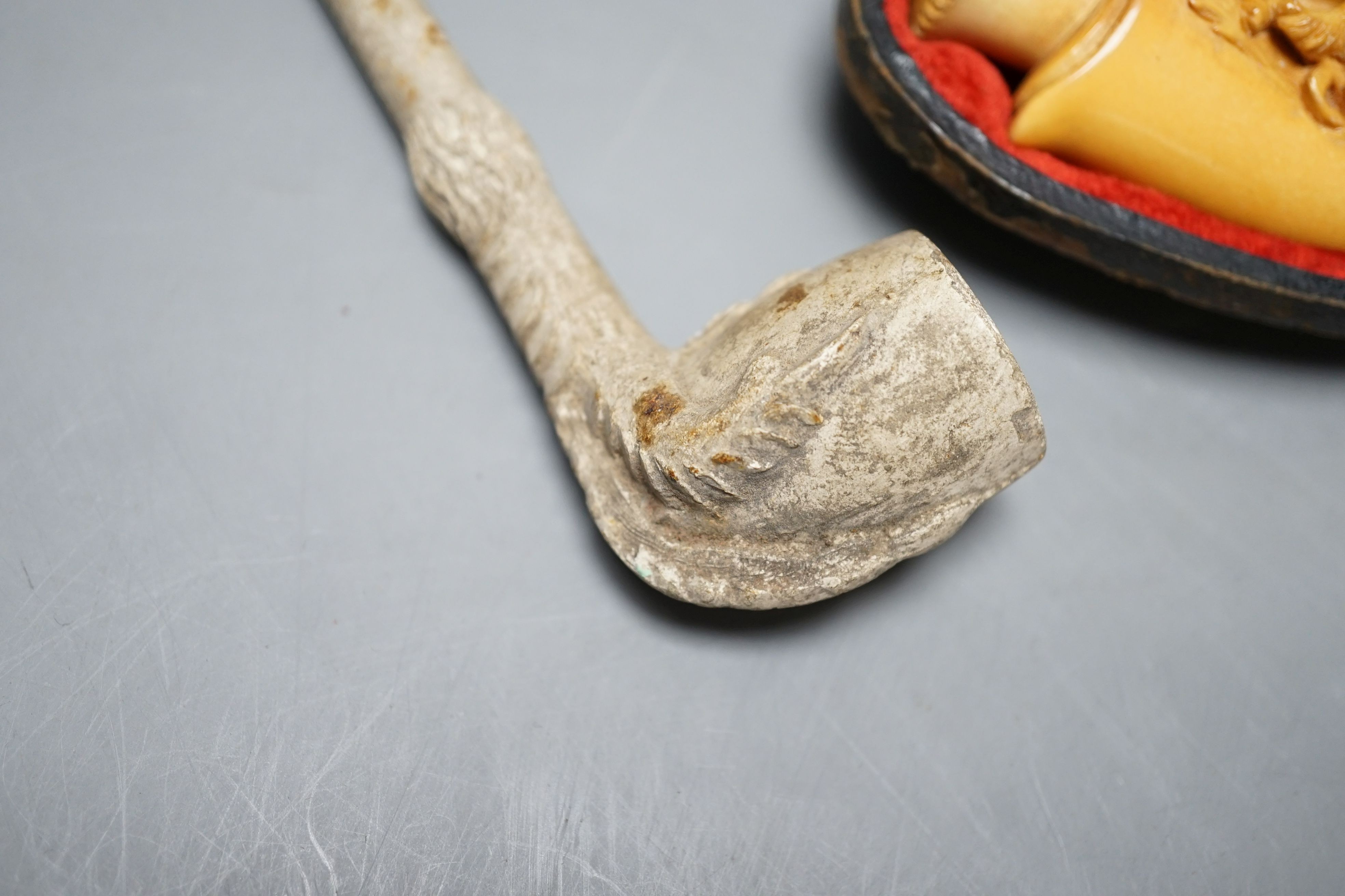 Three cased meerschaum pipes, another pipe and two bone cheroot holders